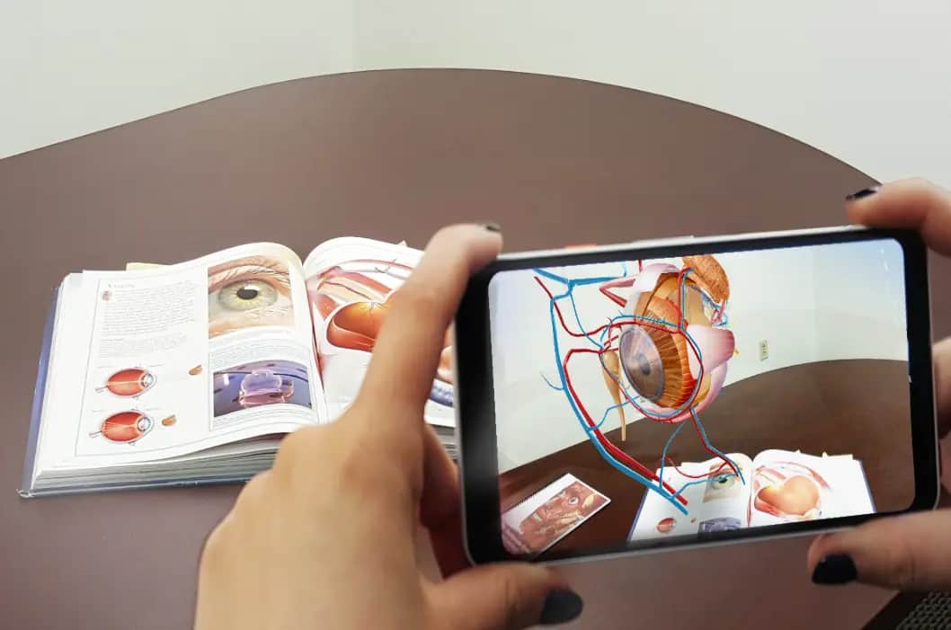 AR education example: 3D human eye anatomy over textbook for classroom learning